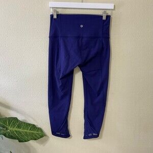 Lululemon Yoga pants Cropped Leggings women Size 8 mesh at hem wide band waist